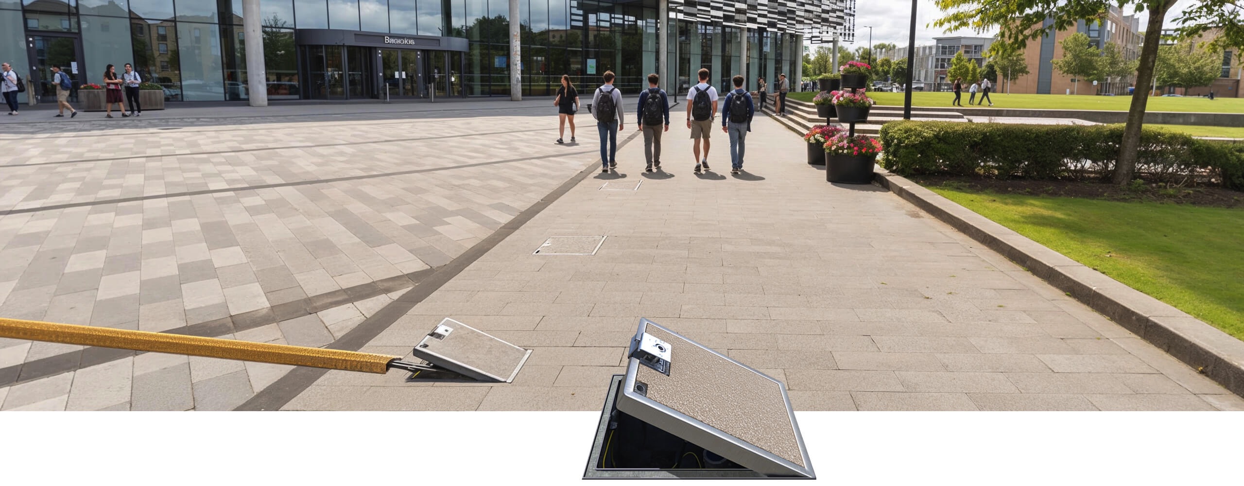 Pop Up Power Supplies in-ground units outside a university campus building
